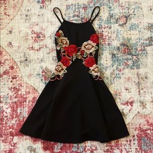 Black cross back dress with flower appliqué